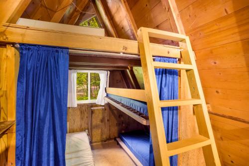 a bedroom with two bunk beds in a cabin at HTR Door County in Egg Harbor