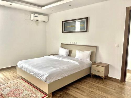 En eller flere senge i et værelse på Succès A5