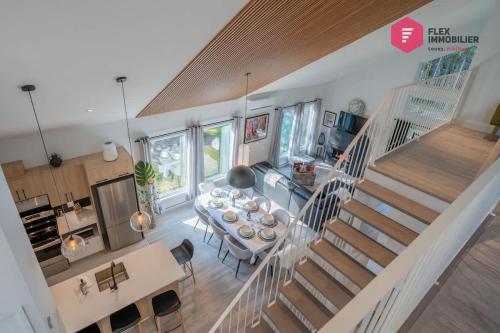 an overhead view of a living room with a staircase at La Casa Bella - Luxury, Comfort, Pool & private SPA in Valcartier Station