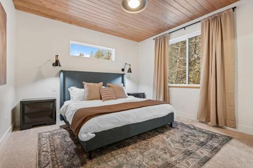 a bedroom with a bed and a window at The Dacha in Island Park
