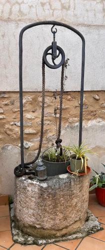 a planter on a wall with some plants in it at La Madre Abadesa, Casa en Casco Historico in Tordesillas