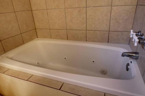 a white bath tub in a bathroom at Alpine Getaway 62 in Helen