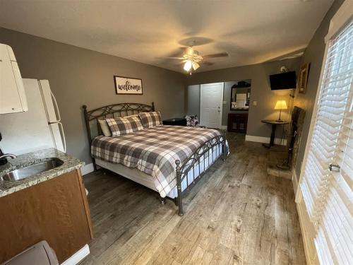 a bedroom with a bed and a sink in it at Bavarian Brook Unit 9 in Helen