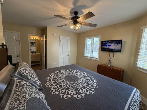 a bedroom with a bed with a ceiling fan at Rivers Edge 703A in Helen