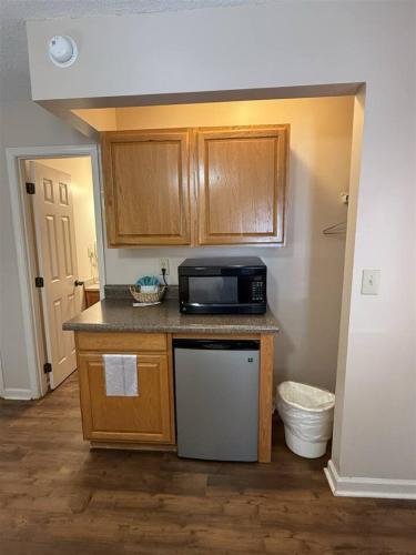 a kitchen with a counter and a microwave at Rivers Edge 803A in Helen