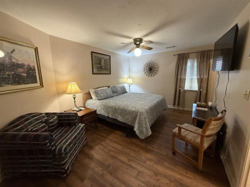 a bedroom with a bed and a couch at Rivers Edge 803B in Helen