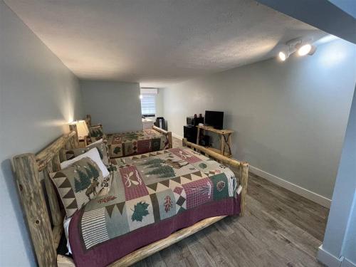 a bedroom with a large bed in a room at Bavarian Brook Unit 6A in Helen