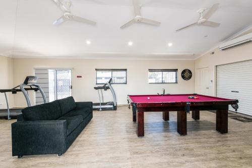 a living room with a pool table and a couch at Athena Studio Units in Roma
