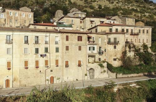a group of buildings on the side of a road at Palazzo Tronconi agriturismo in Arce