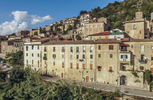 an old building on the side of a mountain at Palazzo Tronconi agriturismo in Arce