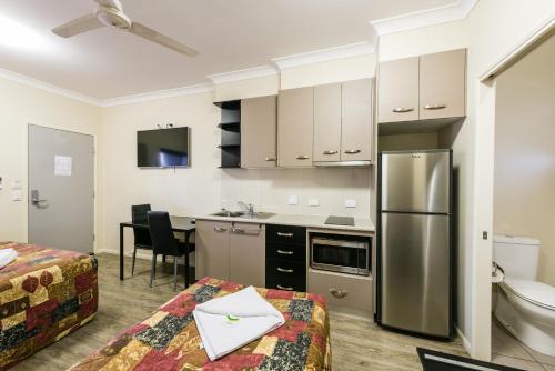 a kitchen with stainless steel appliances in a room at Athena Studio Units in Roma
