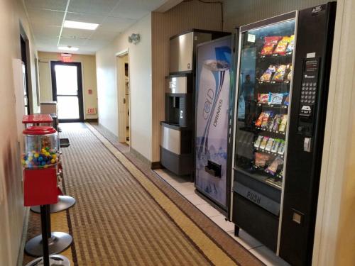 a hallway with a soda vending machine in a hospital at Super 8 by Wyndham Huntington in Huntington