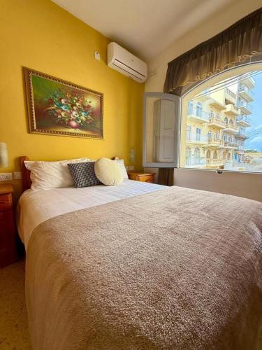 En eller flere senge i et værelse på Horizon Apartments Gozo