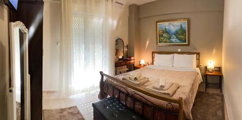 a bedroom with a bed with towels on it at The Bliss Z1 in Kastoria