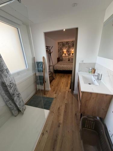 a bathroom with a sink and a mirror at Ocean Lodge Seignosse in Seignosse