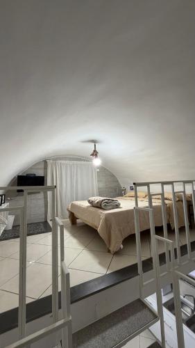 a bedroom with a bed in a room at Casa Della Felicità in Naples