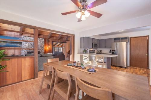 a kitchen and living room with a dining table and a ceiling fan at Dollar Point - Observation Dr, home in Tahoe City