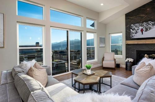 a living room with a couch and a fireplace at Powder Mtn Chalet B4 Ski Escape Hot Tub & View in Eden