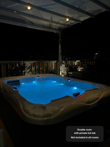 a jacuzzi tub in a room at night at Casa Benita in Hvar
