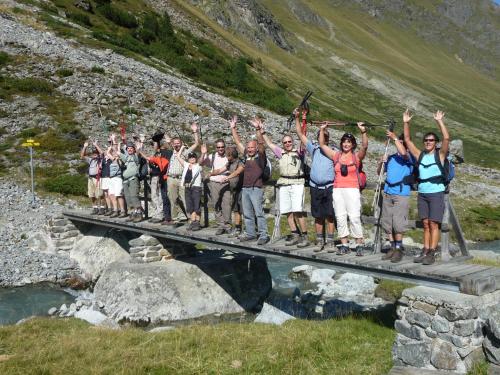 a group of people standing on a bridge at Hotel Serles in Mieders