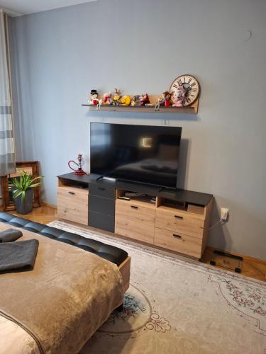 a living room with a large flat screen tv at Apartament Sofia in Sofia