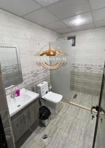 a bathroom with a sink and a toilet at RUM KANARA BUBBLE lUXURY CAMP in Wadi Rum