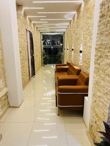 a row of couches in a hallway in a building at El Nabila Front Pyramids & Sphinx View in Cairo