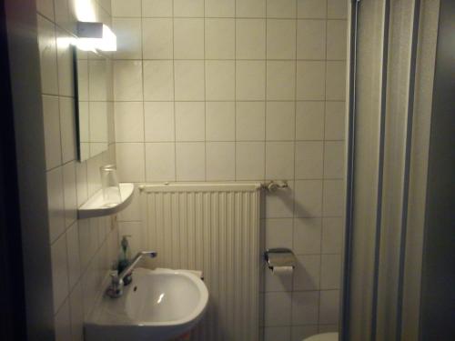 Koupelna v ubytování Hotel-Restaurant Hellmann