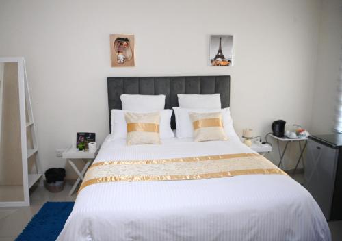 Postel nebo postele na pokoji v ubytování Twinhome Inn