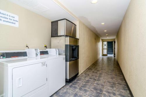 a kitchen with a washer and dryer in a room at Motel 6-Newark, DE in Newark