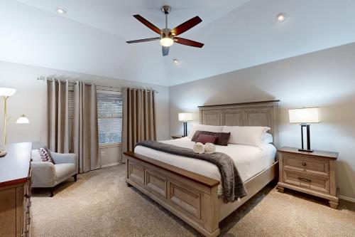a bedroom with a bed and a ceiling fan at Games, Backyard & Patio: Spacious Home in Frisco in Frisco