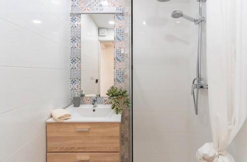 a bathroom with a sink and a mirror at Villa Perdices in Fuengirola