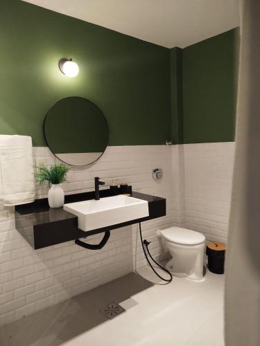 a bathroom with a sink and a toilet at CoVivere - RJ in Rio de Janeiro