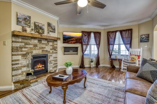 a living room with a fireplace and a couch at Ober Hideaway, Hot Tub, WIFI, 560 FREE tickets each paid day!!! in Gatlinburg