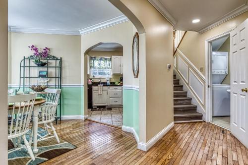 a kitchen and dining room with a table and chairs at Ober Hideaway, Hot Tub, WIFI, 560 FREE tickets each paid day!!! in Gatlinburg