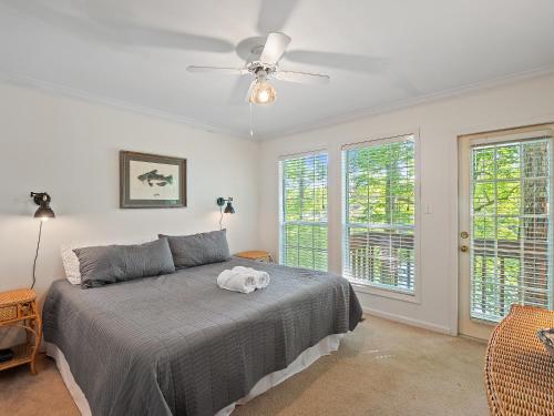 a bedroom with a bed with a stuffed animal on it at Smith Lake Retreat - Close To Trident Marina in Crane Hill