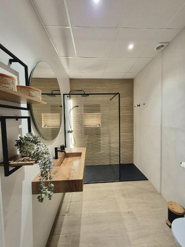 a bathroom with a sink and a mirror at Casa riera in Valderrobres