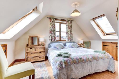 a bedroom with a bed and a dresser and a window at 1 Bed in Welshpool oc-75714 in Meifod