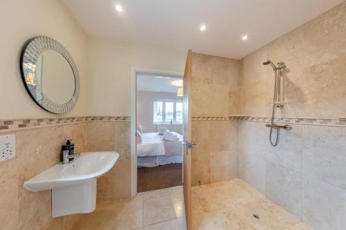 a bathroom with a sink and a shower at 7 Bed in Caerwys oc-58357 in Caerwys