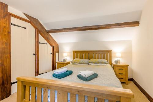 a bedroom with a bed with two pillows on it at 4 Bed in Builth Wells oc-39461 in Builth Wells