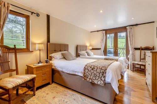 a large bedroom with two beds and a window at 2 Bed in Caersws oc-waa345 in Trefeglwys