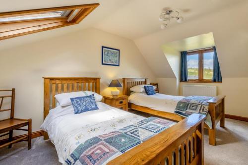 a bedroom with two beds and a window at 4 Bed in Caersws oc-waa321 in Trefeglwys