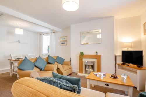 a living room with two couches and a tv at 2 Bed in Betws Y Coed oc-wag474 in Betws-y-coed