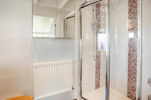 a shower with a glass door in a bathroom at 1 Bed in Mumbles oc-hh631 in Oystermouth
