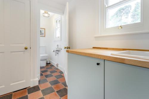 a bathroom with a sink and a toilet at 3 Bed in Cyfronydd oc-e32742 in Llanfair Caereinion