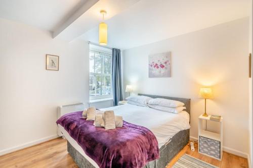 a bedroom with a large bed and a window at 2 Bed in Kendal oc-gl097 in Kendal