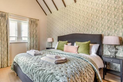 a bedroom with a bed with towels on it at 3 Bed in Calver oc-h33087 in Curbar