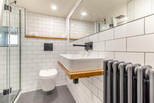 a white bathroom with a sink and a toilet at 3 Bed in Calver oc-h33087 in Curbar