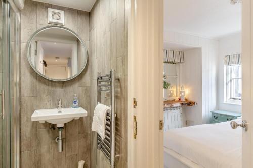 a bathroom with a sink and a mirror at 2 Bed in St. Ives oc-p00568 in St Ives