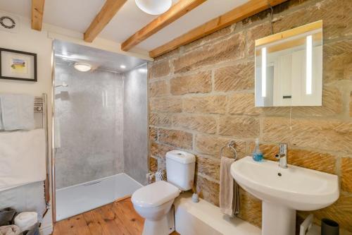 a bathroom with a toilet and a sink and a shower at 2 Bed in Glaisdale oc-wa306 in Glaisdale